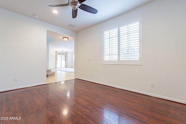 unfurnished room with ceiling fan and hardwood / wood-style floors