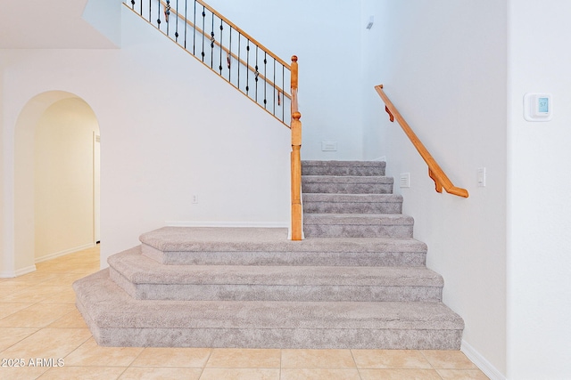 stairway featuring tile patterned floors