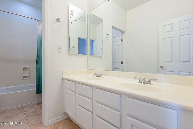 bathroom with vanity, tile patterned floors, and shower / bath combo with shower curtain