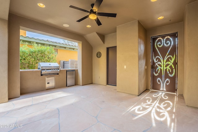 view of patio / terrace with an outdoor kitchen, area for grilling, and ceiling fan