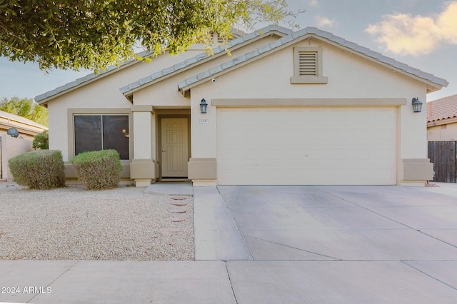 view of front of property with a garage