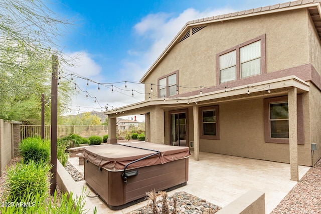 22905 N 19th Way, Phoenix, AZ 85024 - back of house featuring a hot tub, stucco siding, a fenced backyard, and a patio area