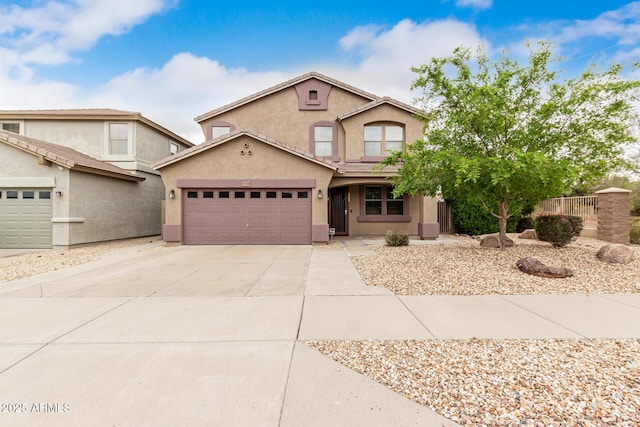 22905 N 19th Way, Phoenix, AZ 85024 - view of front of house featuring stucco siding, an attached garage, and driveway