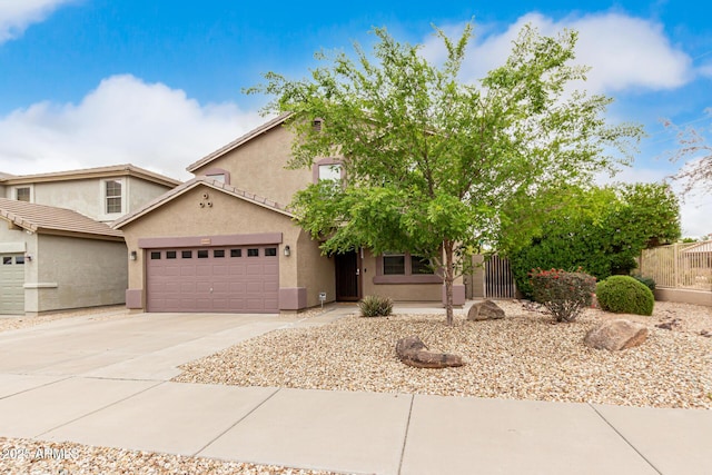 22905 N 19th Way, Phoenix, AZ 85024 - view of front of home featuring a garage, stucco siding, concrete driveway, and fence
