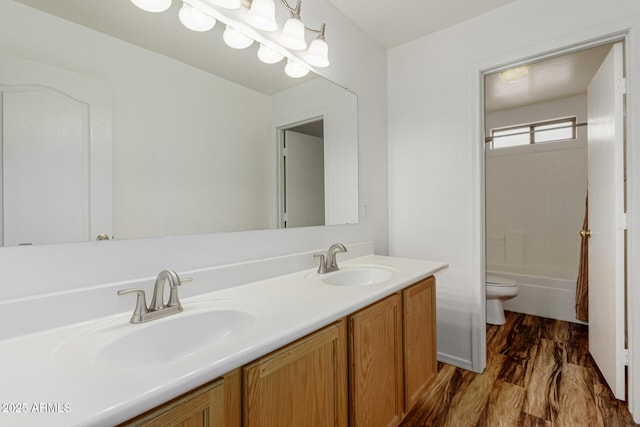 22905 N 19th Way, Phoenix, AZ 85024 - bathroom featuring toilet, double vanity, shower / washtub combination, and wood finished floors