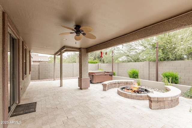 22905 N 19th Way, Phoenix, AZ 85024 - view of patio / terrace featuring a hot tub, an outdoor fire pit, a ceiling fan, and a fenced backyard