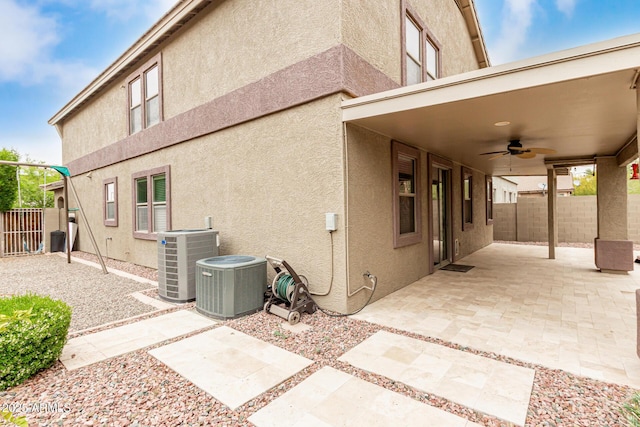 22905 N 19th Way, Phoenix, AZ 85024 - view of property exterior with cooling unit, a ceiling fan, a patio, and a fenced backyard