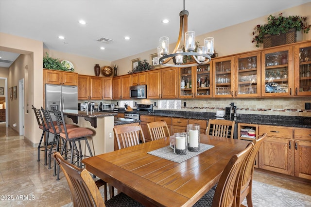 dining space with a notable chandelier