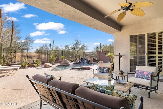 view of patio with ceiling fan and a fenced in pool