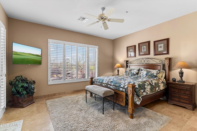 bedroom with ceiling fan and light tile patterned flooring