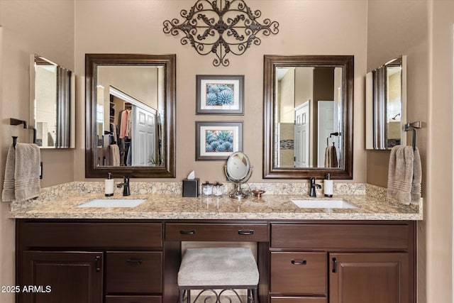 bathroom with an inviting chandelier and vanity