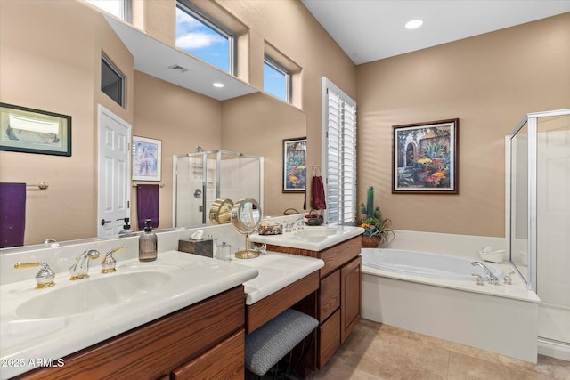 bathroom with vanity, tile patterned flooring, and independent shower and bath