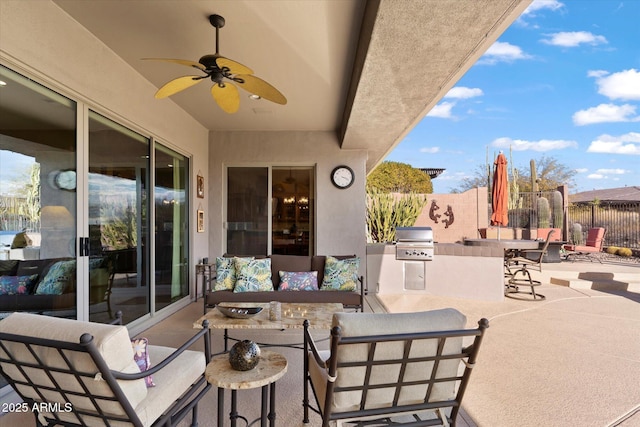 view of patio with ceiling fan, outdoor lounge area, an outdoor kitchen, and area for grilling