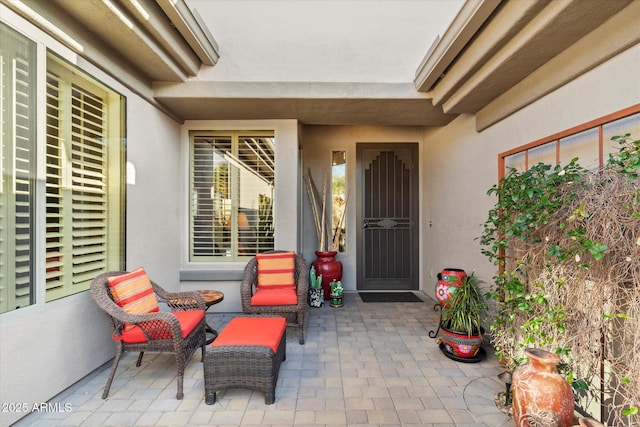 entrance to property featuring a patio