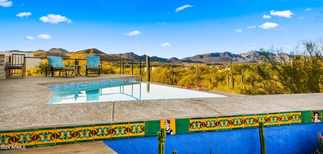 view of pool featuring a mountain view