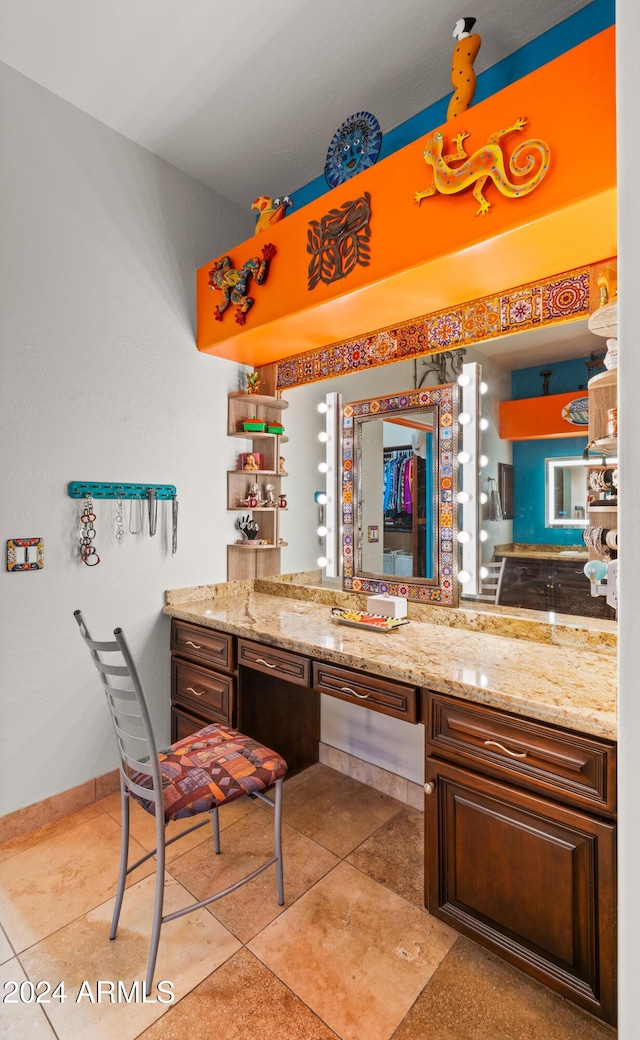 interior space featuring tile patterned floors and vanity