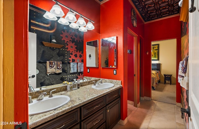 bathroom with tile patterned flooring and vanity