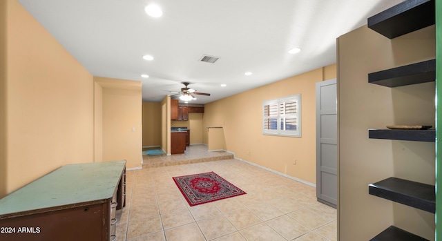 interior space featuring ceiling fan and light tile patterned floors