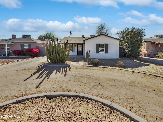 single story home with fence and driveway