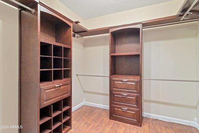 walk in closet featuring wood-type flooring