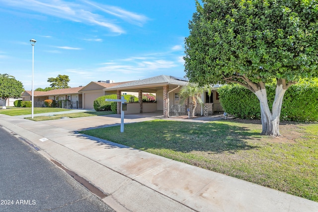 single story home featuring a front yard and a garage