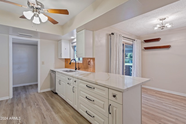 kitchen with ceiling fan, stainless steel dishwasher, sink, light hardwood / wood-style flooring, and white cabinets