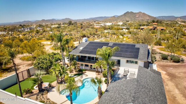 birds eye view of property with a mountain view