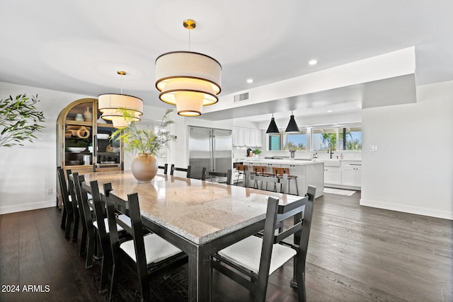 dining room with dark hardwood / wood-style flooring