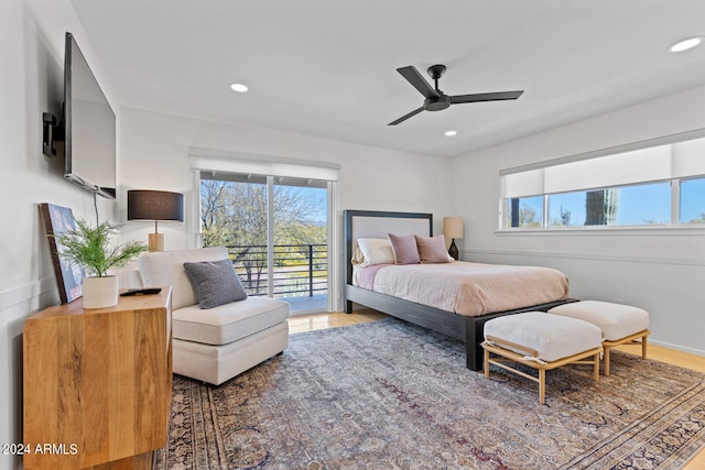 bedroom with ceiling fan, hardwood / wood-style flooring, and access to exterior