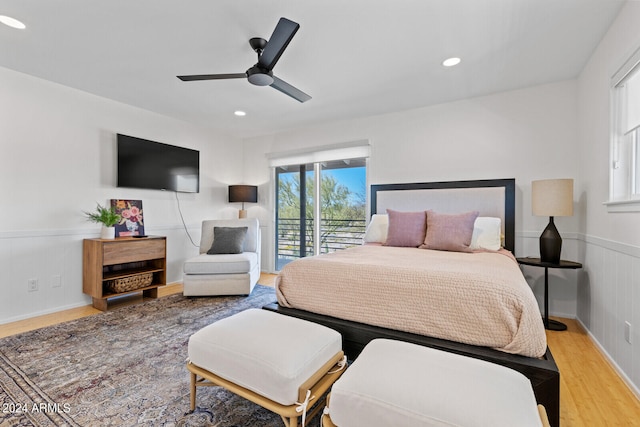 bedroom with ceiling fan, light hardwood / wood-style floors, and access to outside