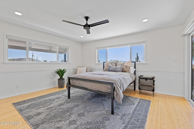 bedroom with hardwood / wood-style flooring and ceiling fan