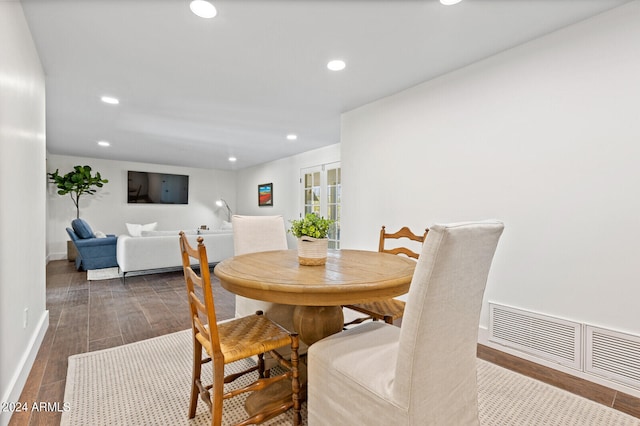 dining space with hardwood / wood-style floors