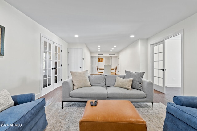 living room featuring french doors and hardwood / wood-style floors