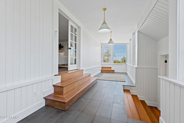 interior space with dark hardwood / wood-style floors and french doors