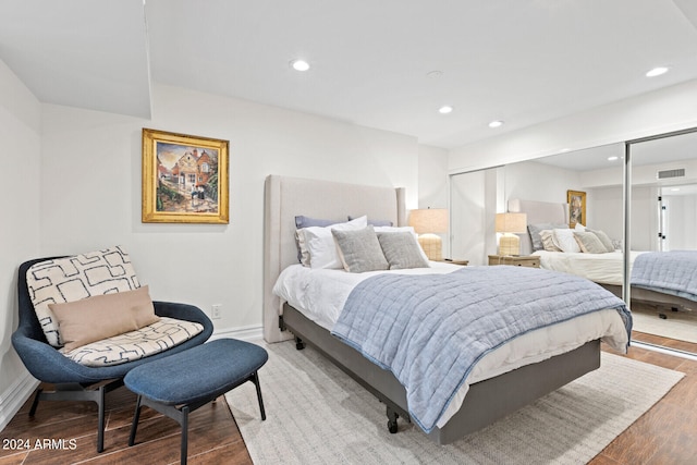 bedroom with hardwood / wood-style flooring