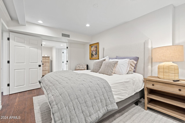 bedroom with dark wood-type flooring