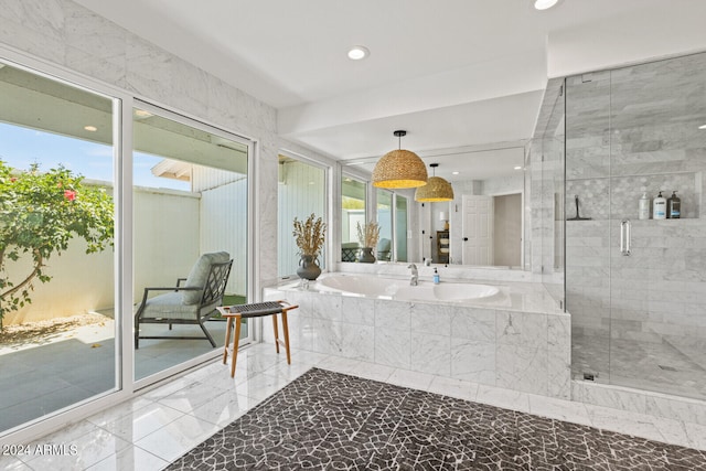 bathroom with tile floors and separate shower and tub