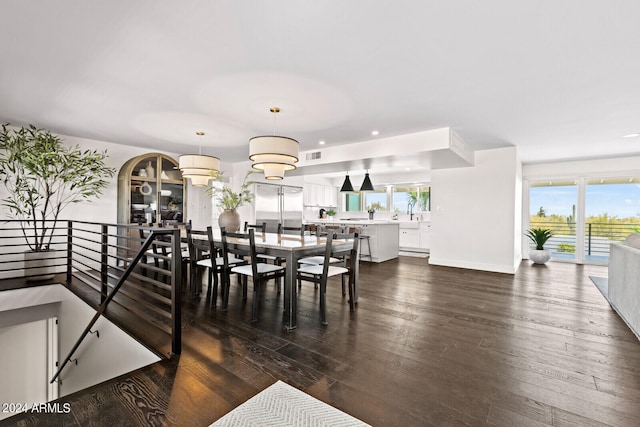 dining space featuring dark hardwood / wood-style flooring