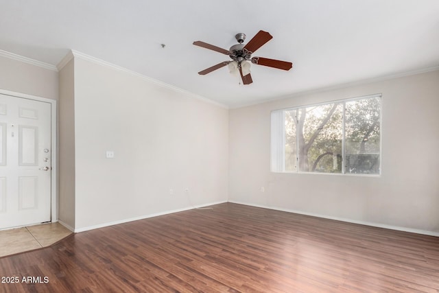 spare room with ceiling fan, ornamental molding, and light hardwood / wood-style floors