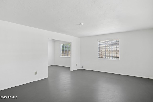 541 W Vernon Ave, Phoenix, AZ 85003 - spare room with finished concrete flooring and baseboards