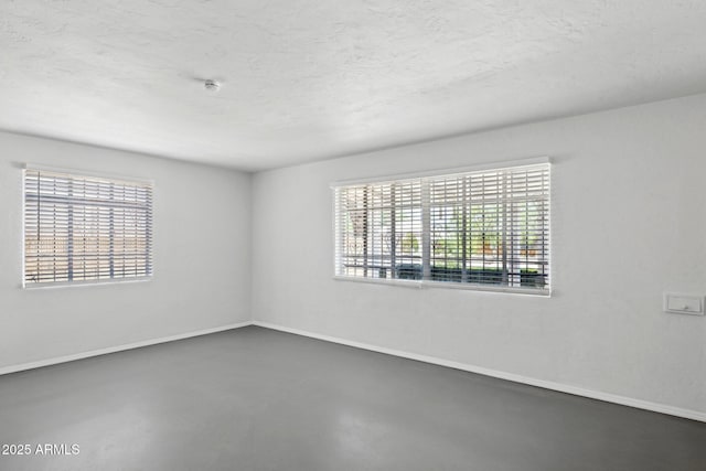541 W Vernon Ave, Phoenix, AZ 85003 - spare room with concrete floors, a smoke detector, and a textured ceiling