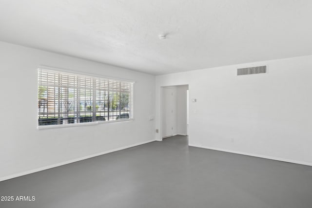 541 W Vernon Ave, Phoenix, AZ 85003 - empty room featuring finished concrete flooring and a smoke detector