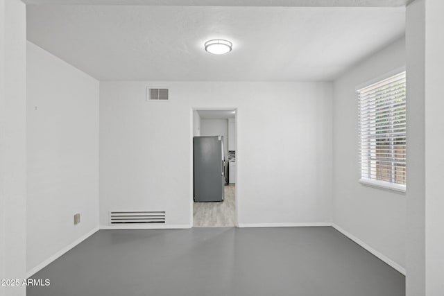 541 W Vernon Ave, Phoenix, AZ 85003 - empty room featuring baseboards and concrete flooring