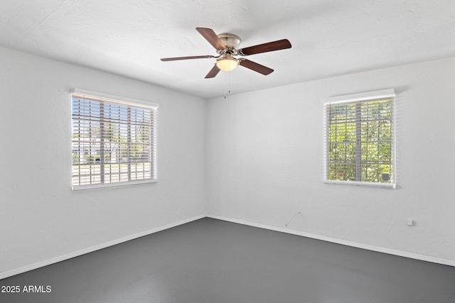 541 W Vernon Ave, Phoenix, AZ 85003 - spare room featuring healthy amount of natural light, ceiling fan, and concrete flooring