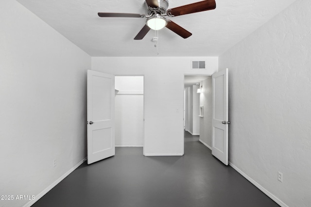 541 W Vernon Ave, Phoenix, AZ 85003 - unfurnished bedroom with concrete floors, ceiling fan, and a closet
