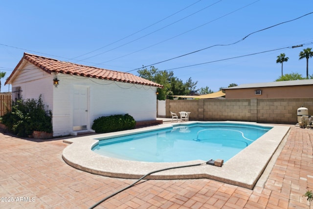 541 W Vernon Ave, Phoenix, AZ 85003 - view of swimming pool featuring a patio area, a fenced backyard, and an outdoor structure