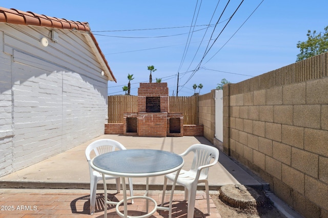 541 W Vernon Ave, Phoenix, AZ 85003 - fenced backyard with a fireplace and a patio area