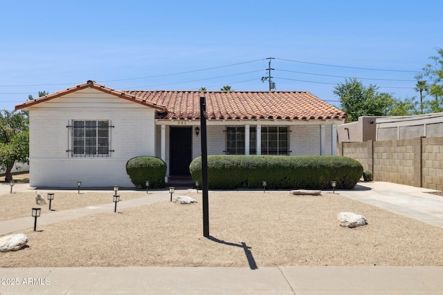 541 W Vernon Ave, Phoenix, AZ 85003 - mediterranean / spanish-style house featuring a tiled roof and brick siding