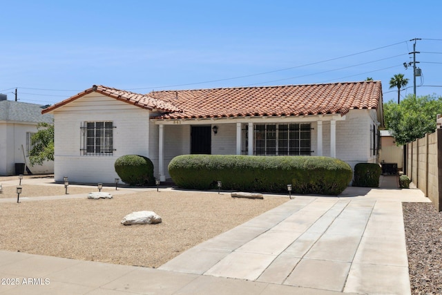 541 W Vernon Ave, Phoenix, AZ 85003 - mediterranean / spanish-style house featuring a tile roof and brick siding