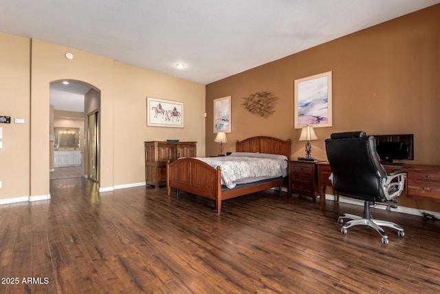 bedroom with dark hardwood / wood-style flooring